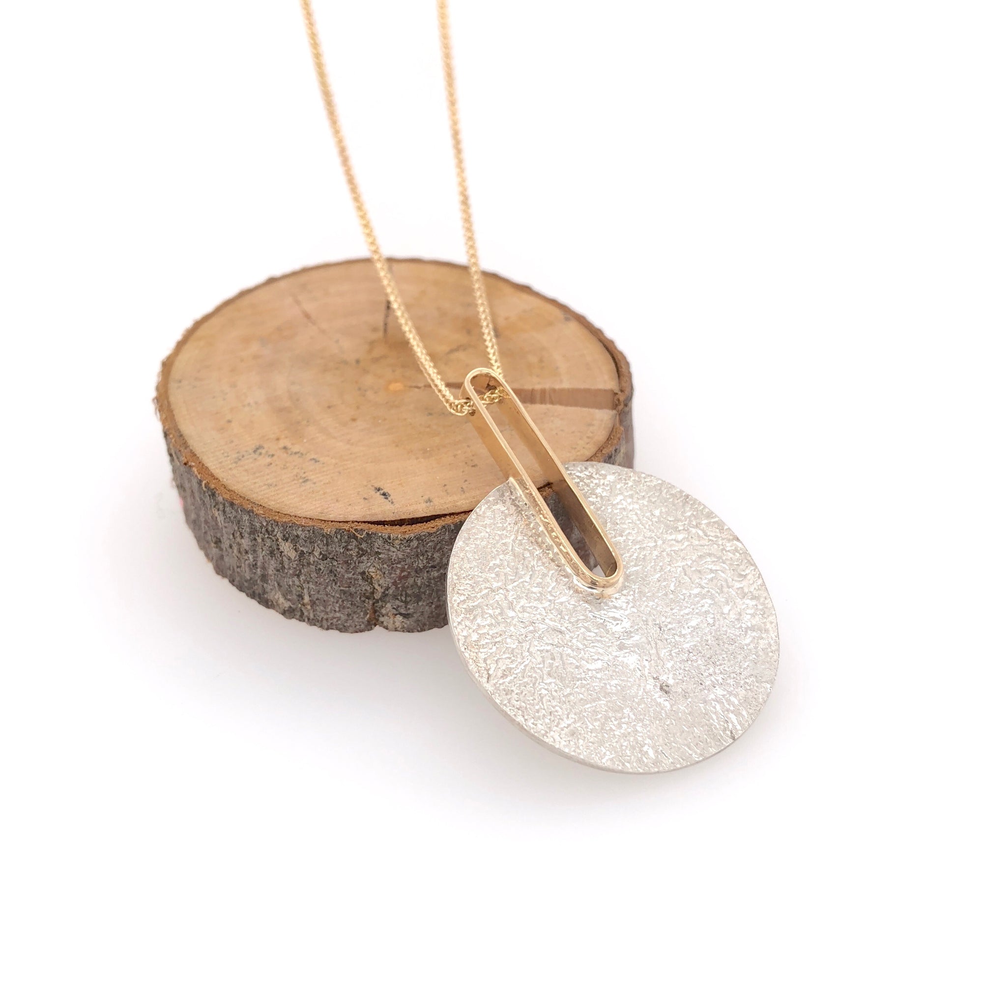 Reticulated Landscape and Gold Pendant