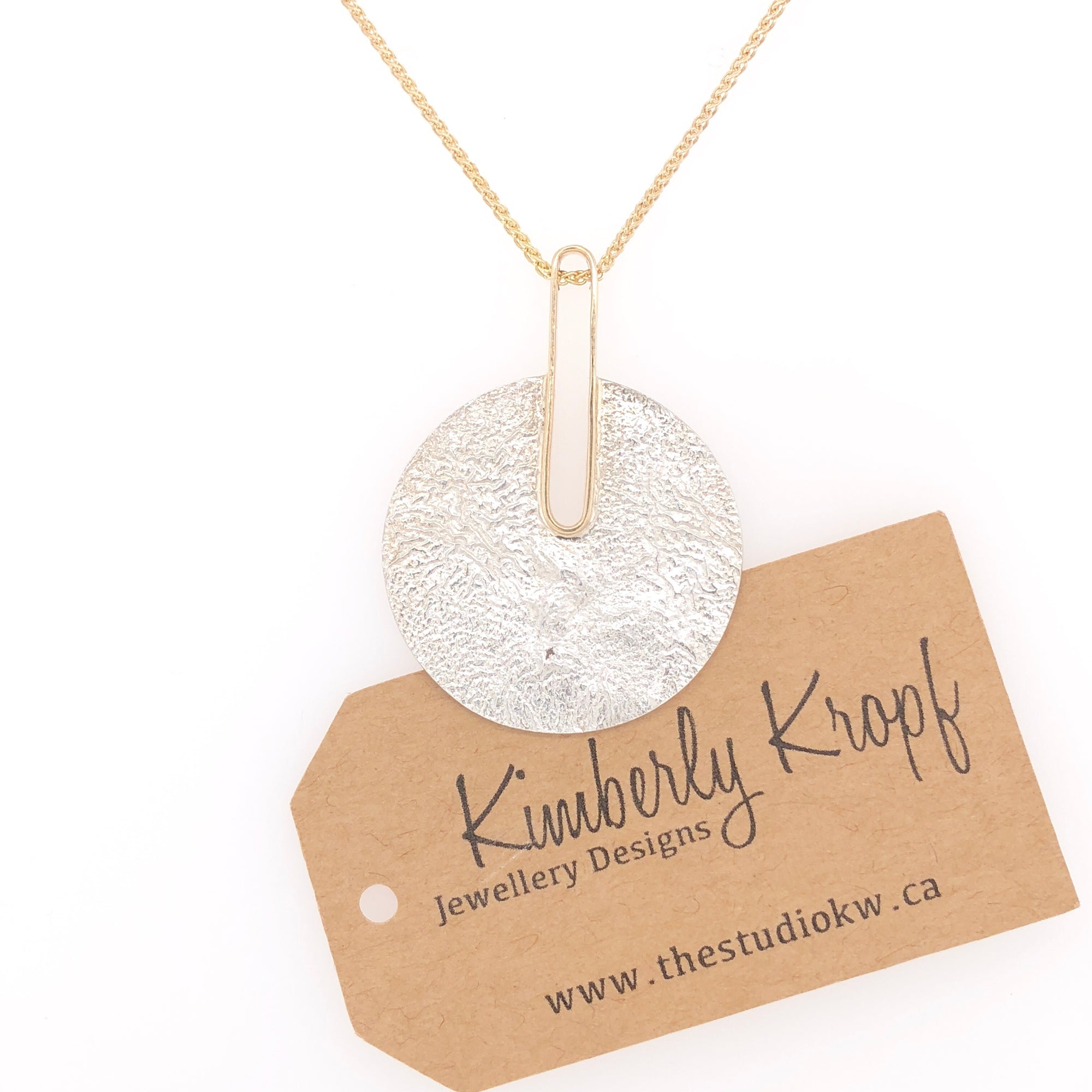 Reticulated Landscape and Gold Pendant