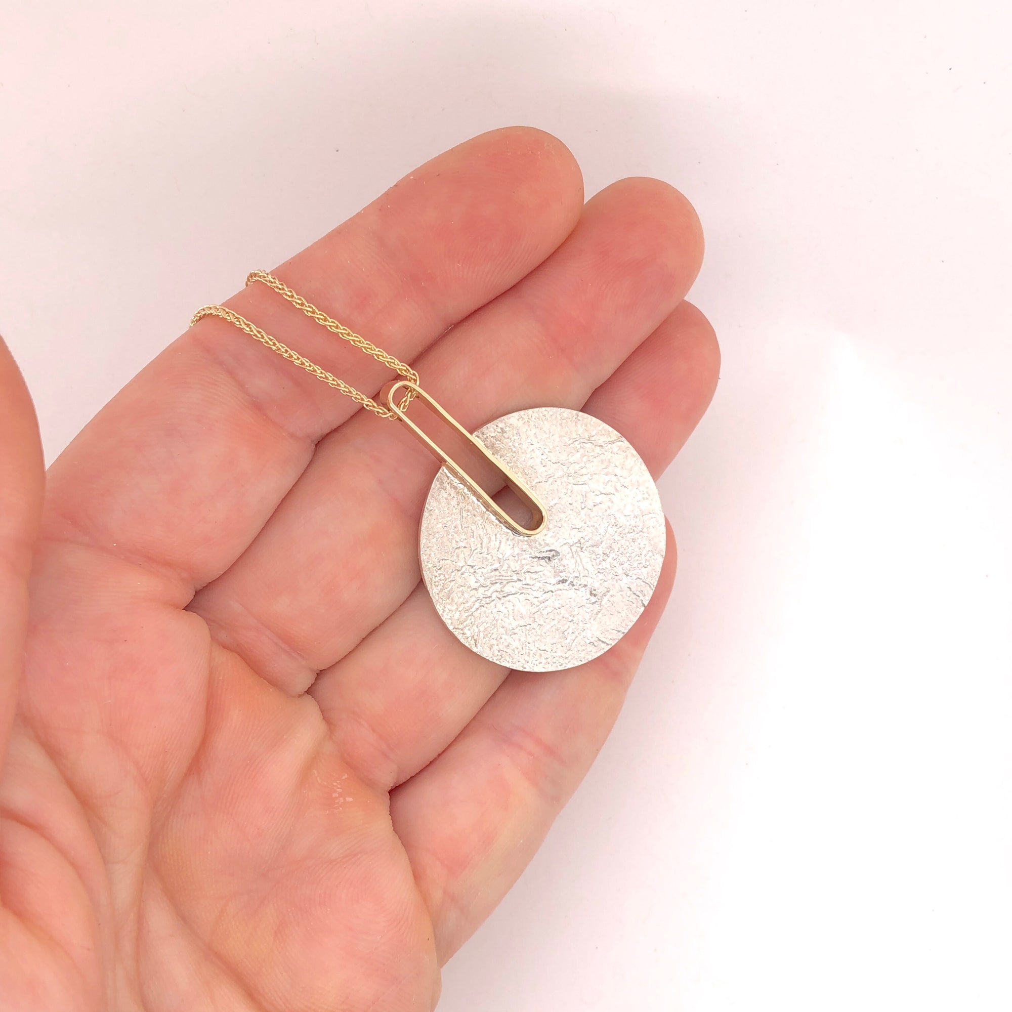 Reticulated Landscape and Gold Pendant