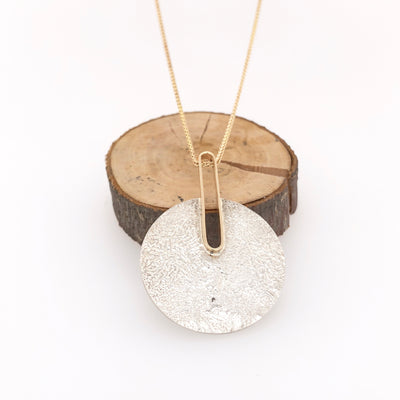 Reticulated Landscape and Gold Pendant